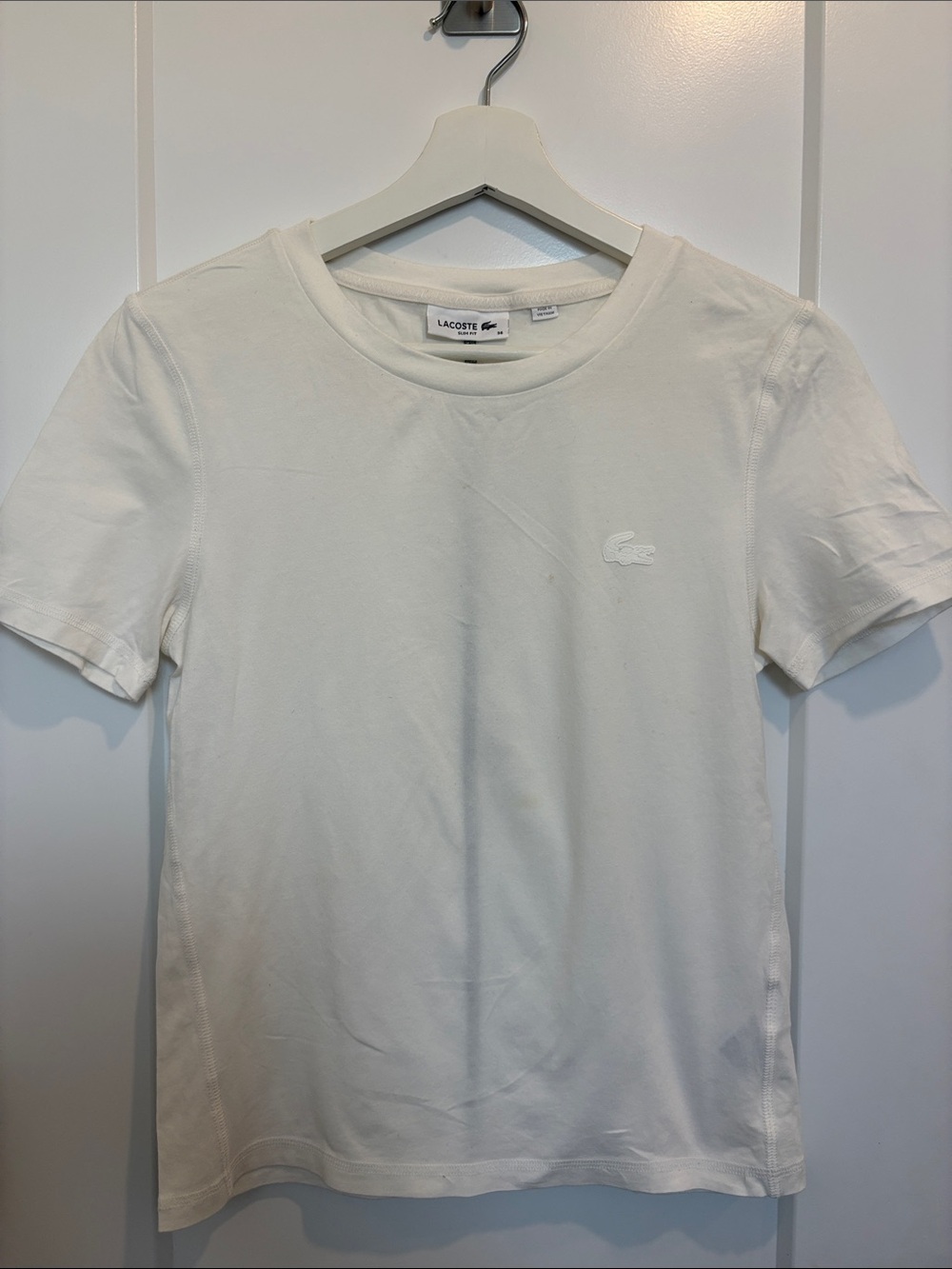 Lacoste Women's Short Sleeve Crew Tee in Off-White. Has small stain in the front